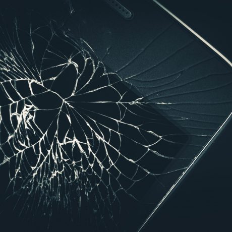 Cellphone Broken Display Closeup Photo. Broken Smartphone Device.